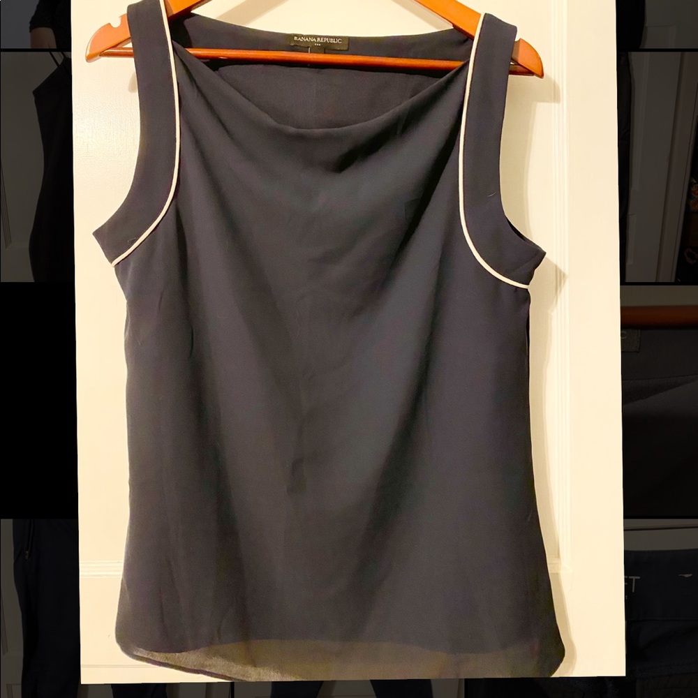 Navy blue cowl neck sleeveless blouse.